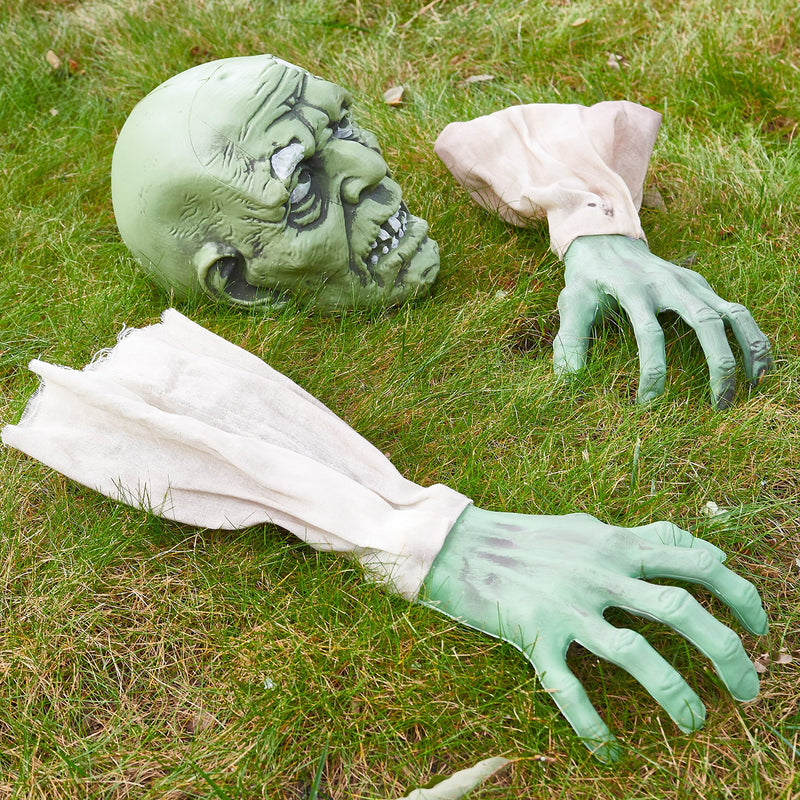 Halloween zombie face and arms as lawn stakes for the best cemetery decor